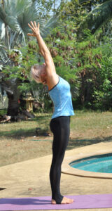 Hasta Uttanasana, stretching pose with arms up