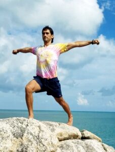 Virabhadrasana 2, warrior pose on the rock