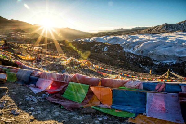 Rainbow Buddhist flags in the mountains