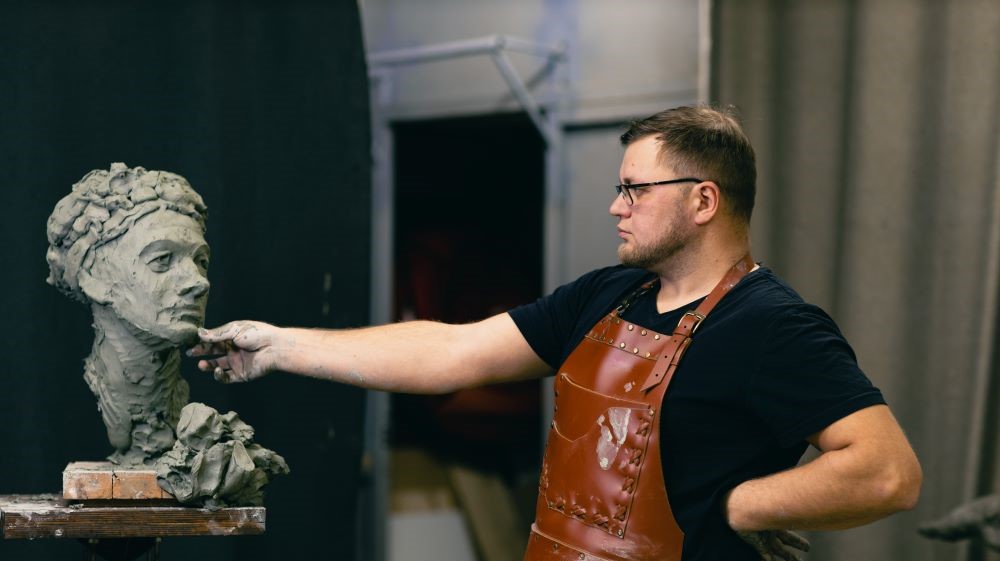 A male sculptor at work