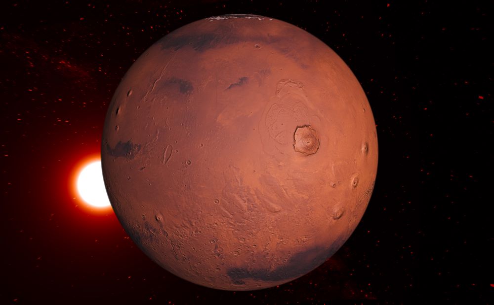 Sunrise behind the red disk of Mars