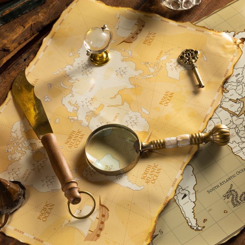 An ancient map with a magnifying glass