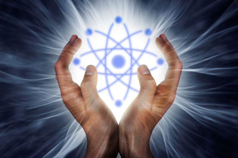 Hands embracing atoms of energy