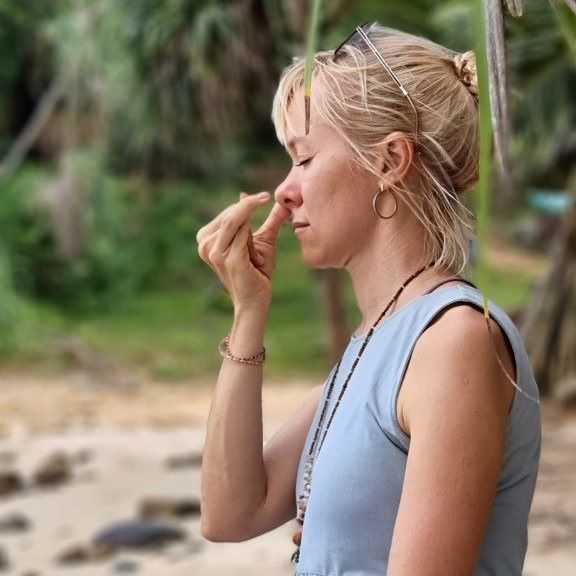 Olya meditates on the ocean