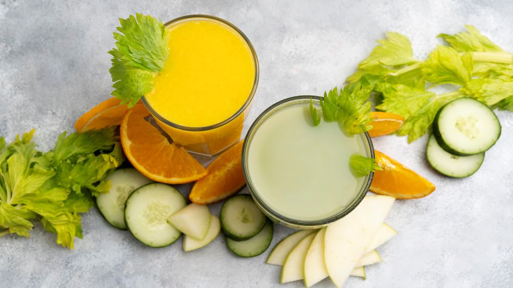 Photo of green and orange juices